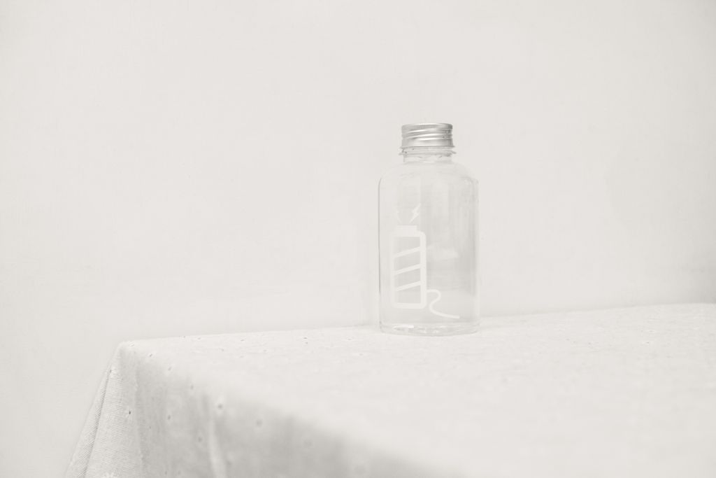 Simple and clean image of a glass jar on a white tablecloth, showcasing minimalism.